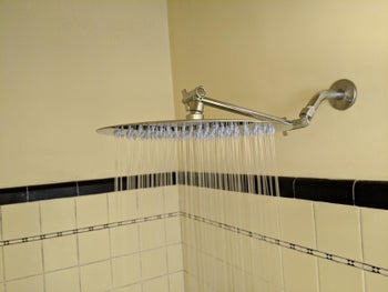 Reviewer photo of the shower head turned on