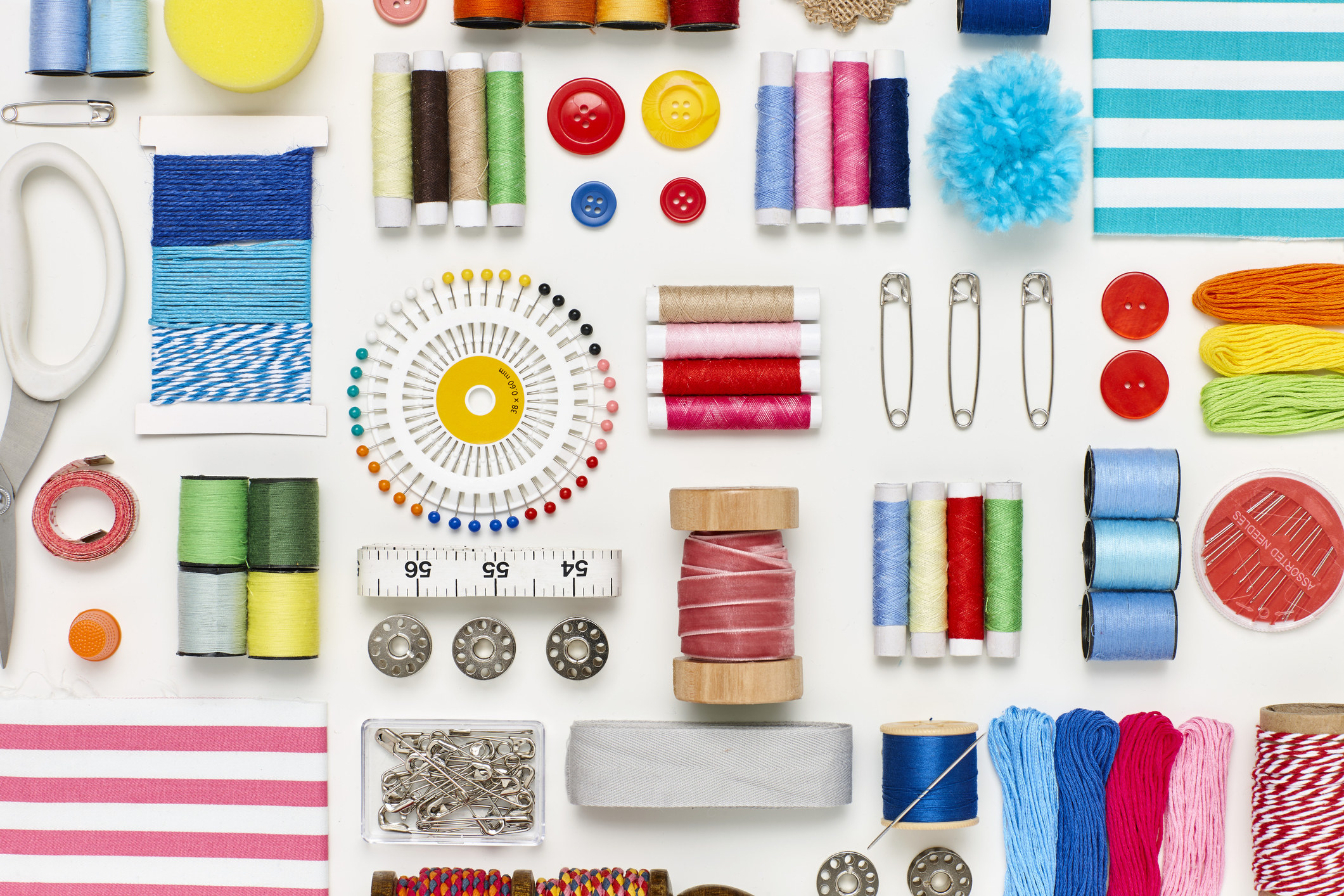 Top down shot of a variety of sewing materials.