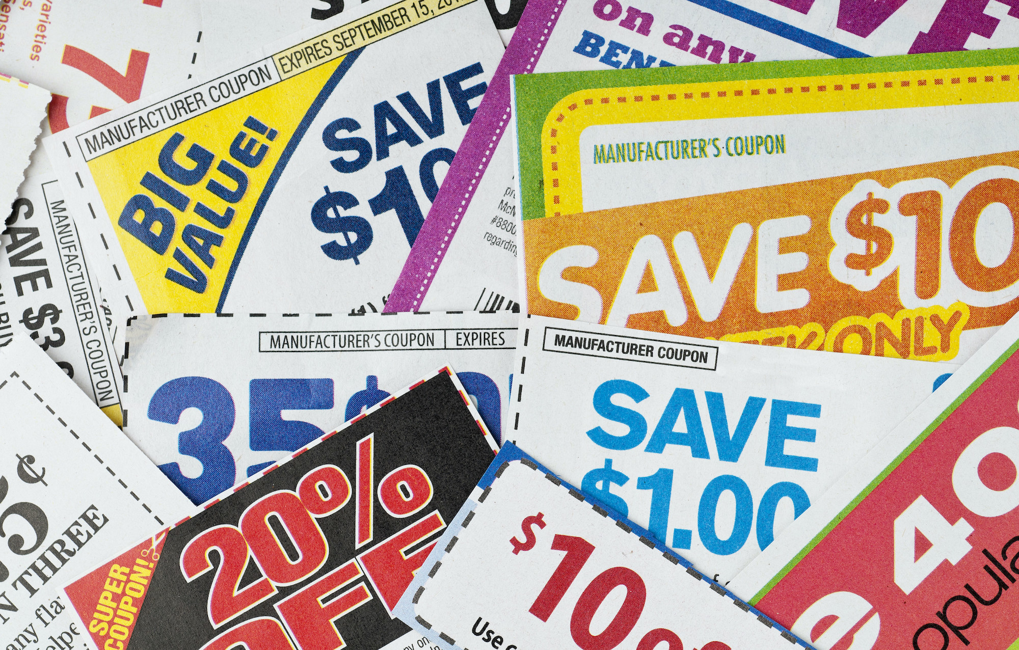 A stack of coupons with varying deals.