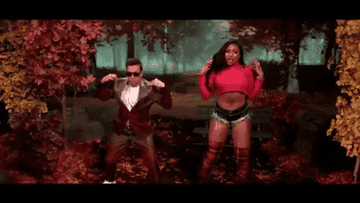 Jimmy Fallon and Megan Thee Stallion dancing in fall leaves
