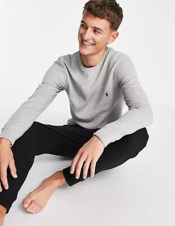 Male model wearing the grey long sleeve shirt