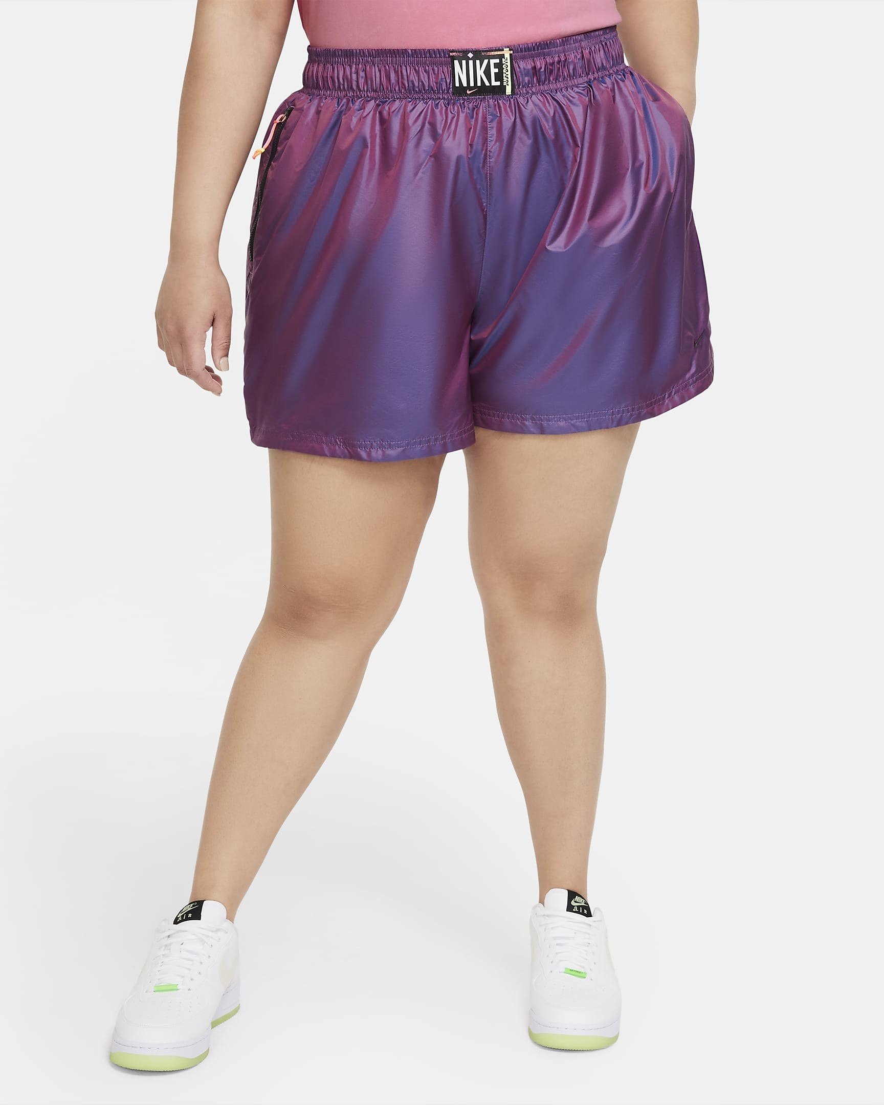Model wearing purple iridescent shorts