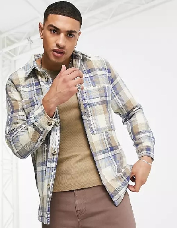 Model wearing the button-down flannel