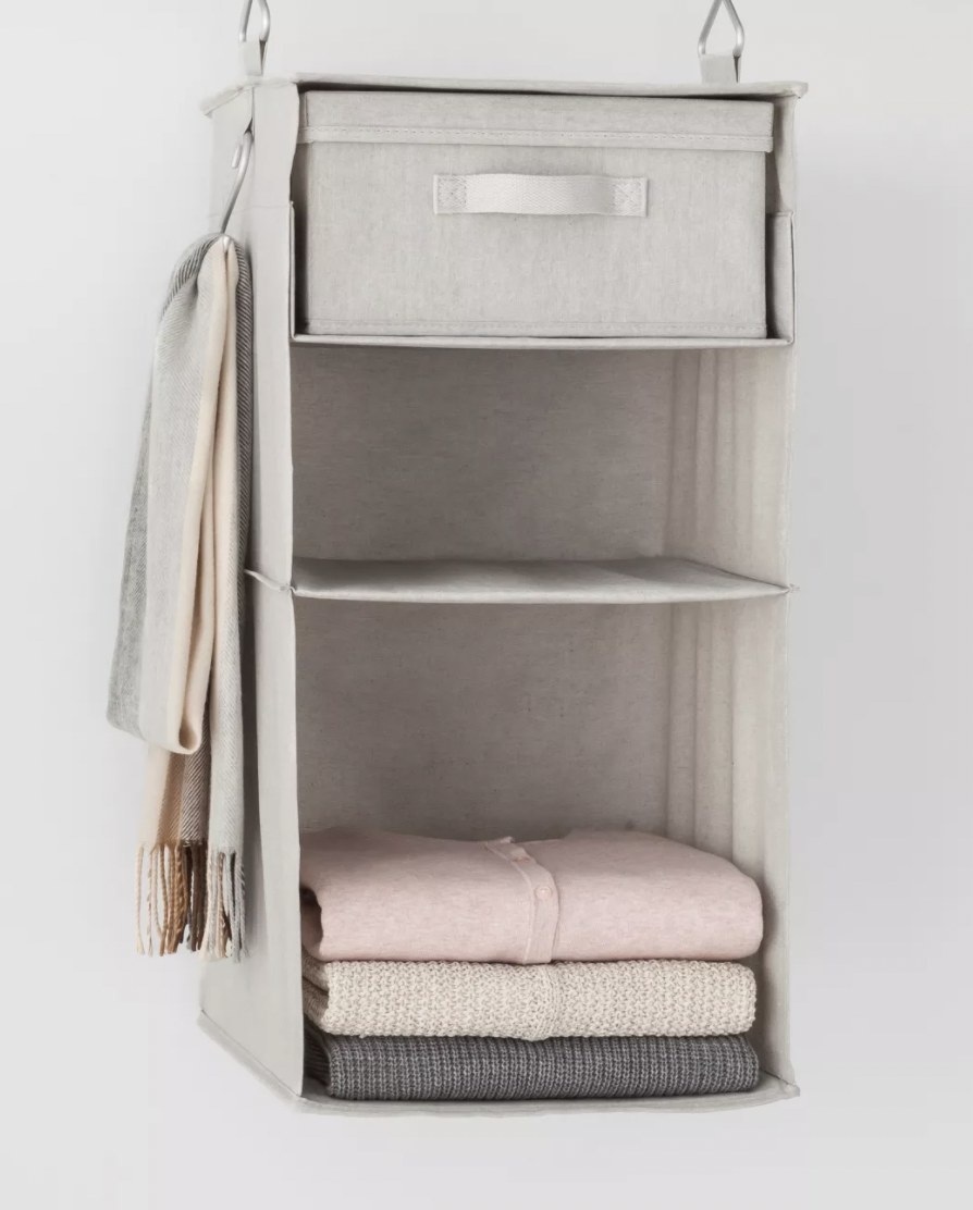 soft hanging organizer with a drawer in the top section and two cubbies below