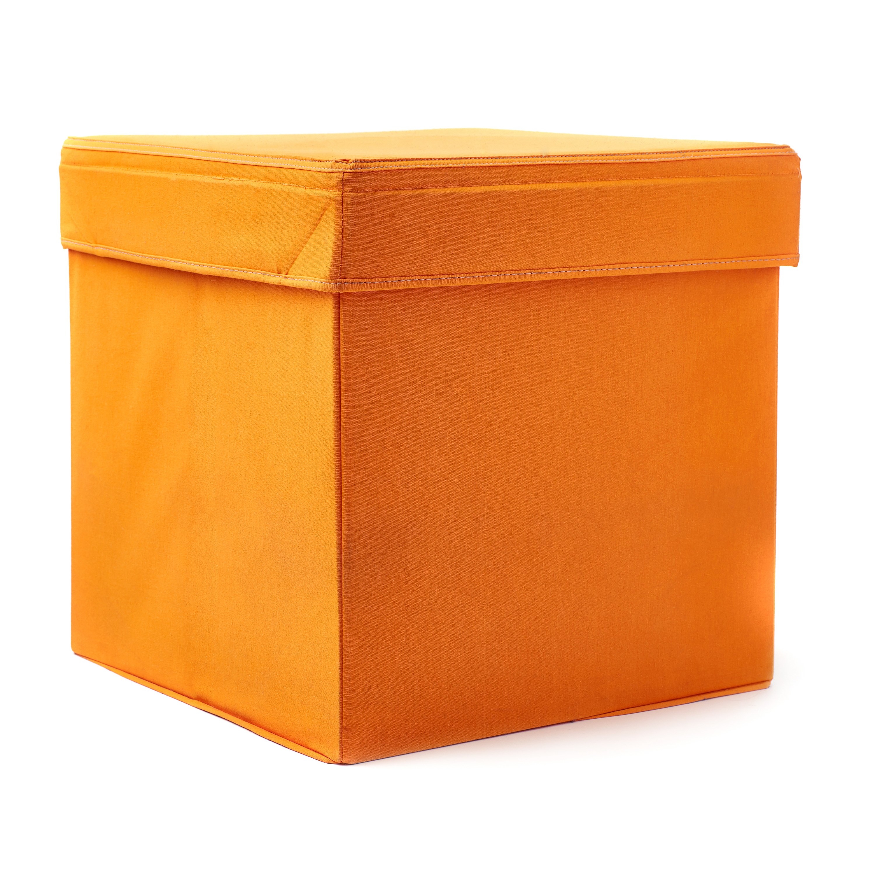 Photo of an orange seating cube against a white backdrop