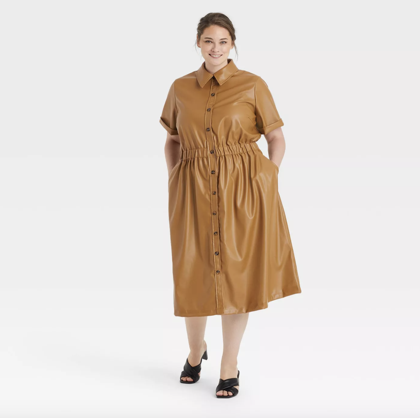 model in knee length shirt dress silhouette light brown faux leather dress