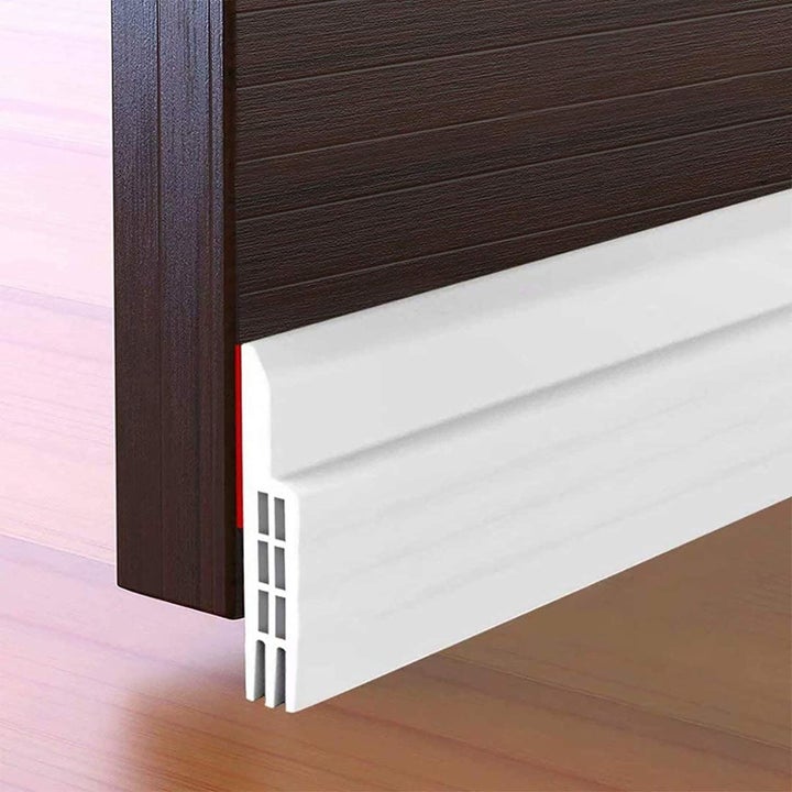 white stopper along bottom of a door