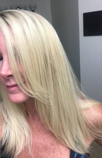 another blonde reviewer showing their sleek straight blowout