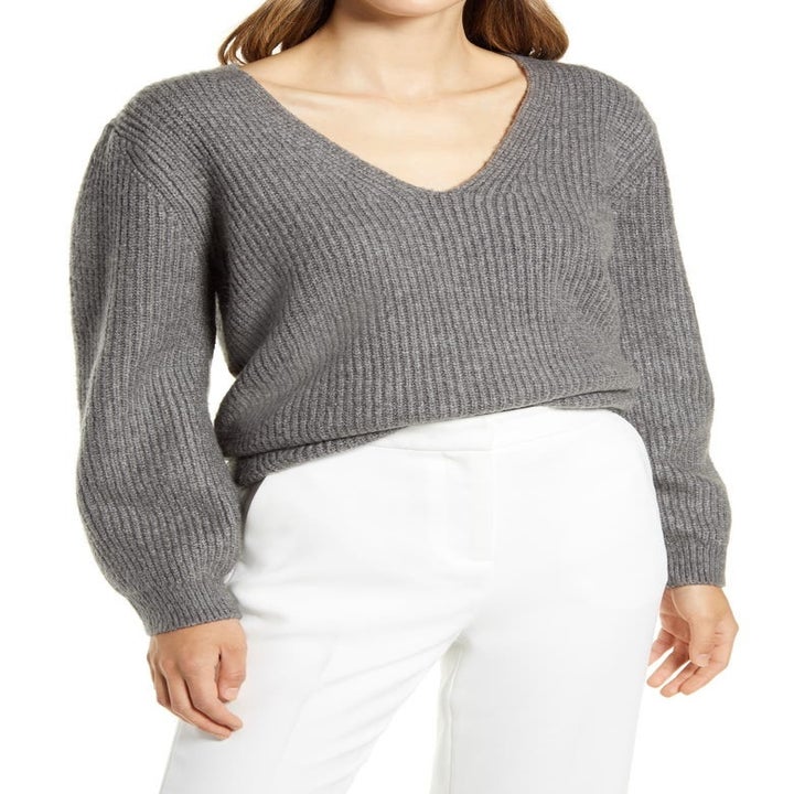 model in gray V-neck balloon-sleeve sweater