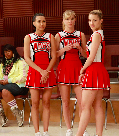 Quinn, Santana, and Brittany standing in the choir room on &quot;Glee&quot;