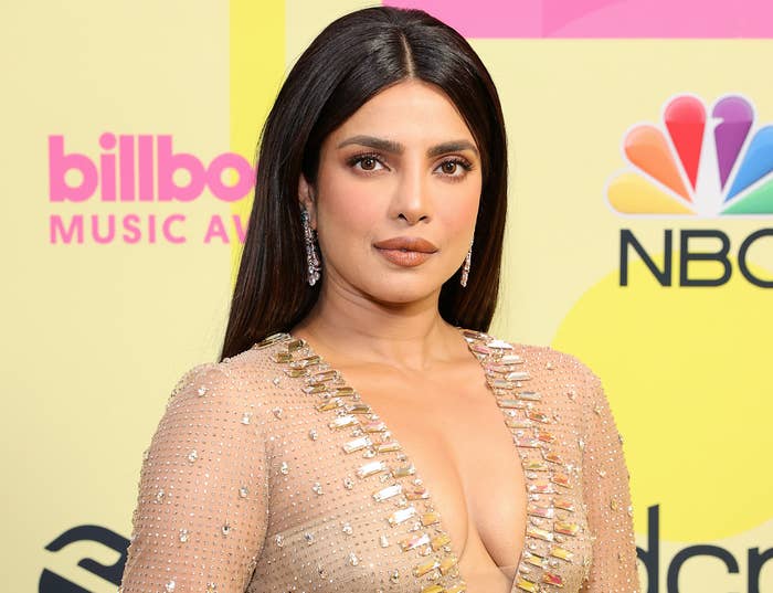 Priyanka wears a sheer jewel encrusted dress with a deep neckline