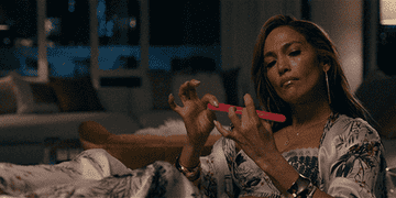 GIF of woman filing her nails
