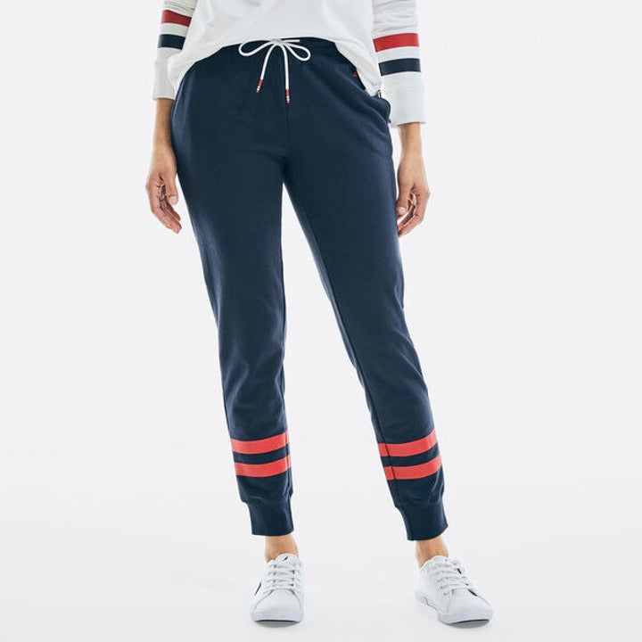 model in navy striped sweatpants