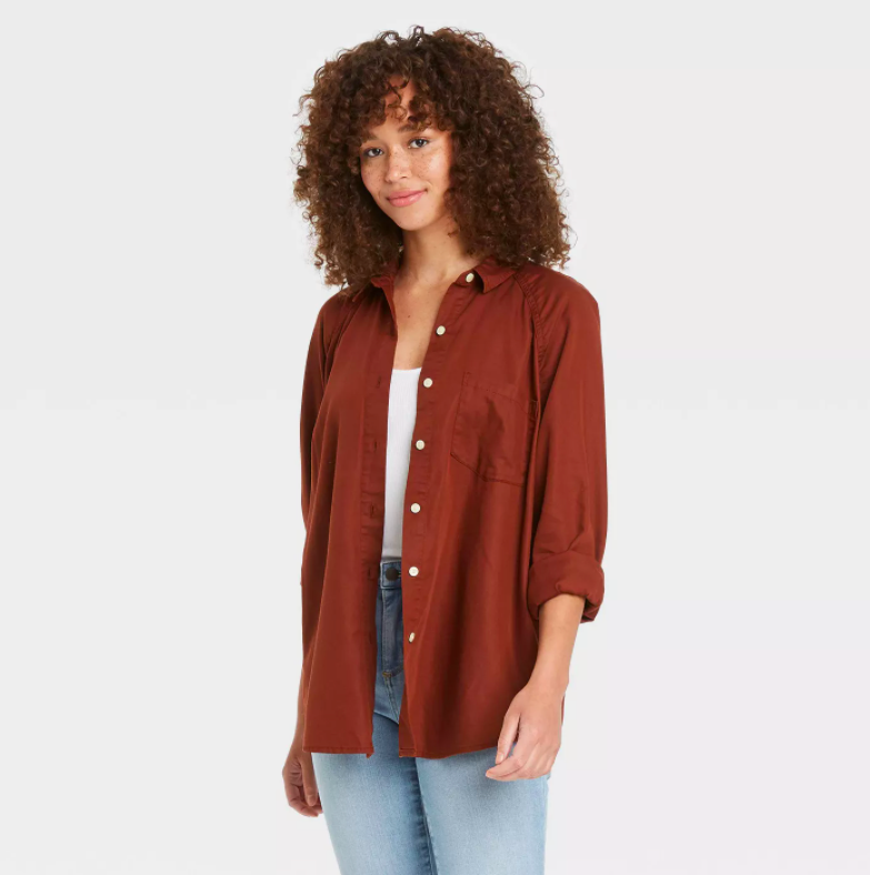 a model wearing the button up in burgundy
