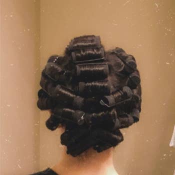 A reviewer with the curlers in their hair