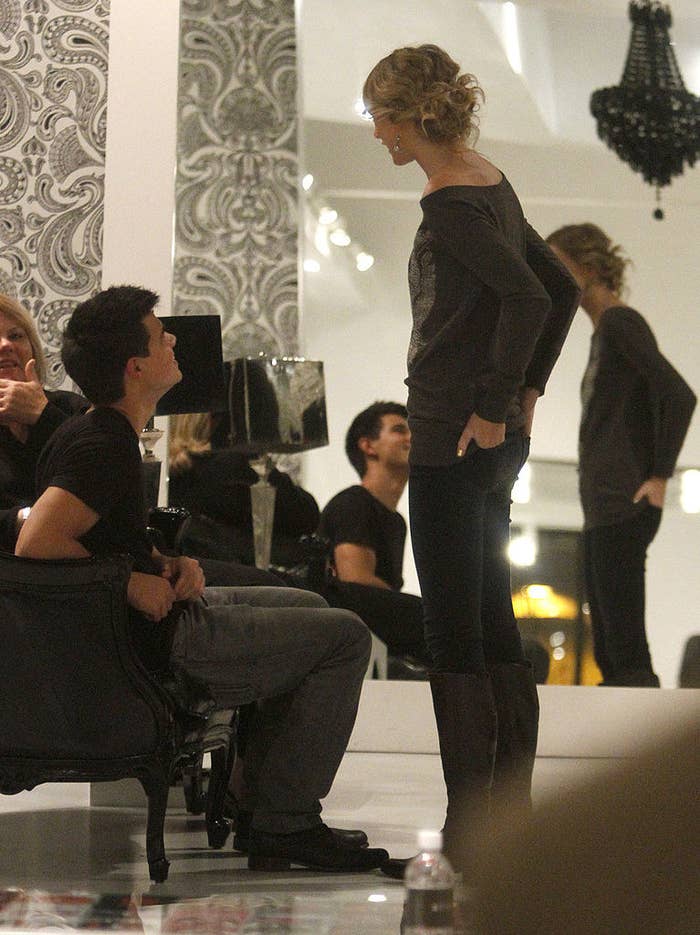 she's standing over them and theyre chatting