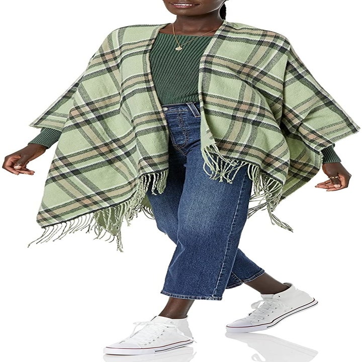 model wearing the blanket scarf in green plaid