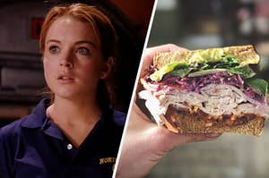 A close up of Cady from "Mean Girls" looking surprised and hand holds half a turkey sandwich with veggies on it