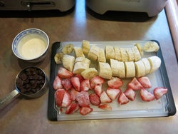 Sliced frozen fruit placed on cutting board
