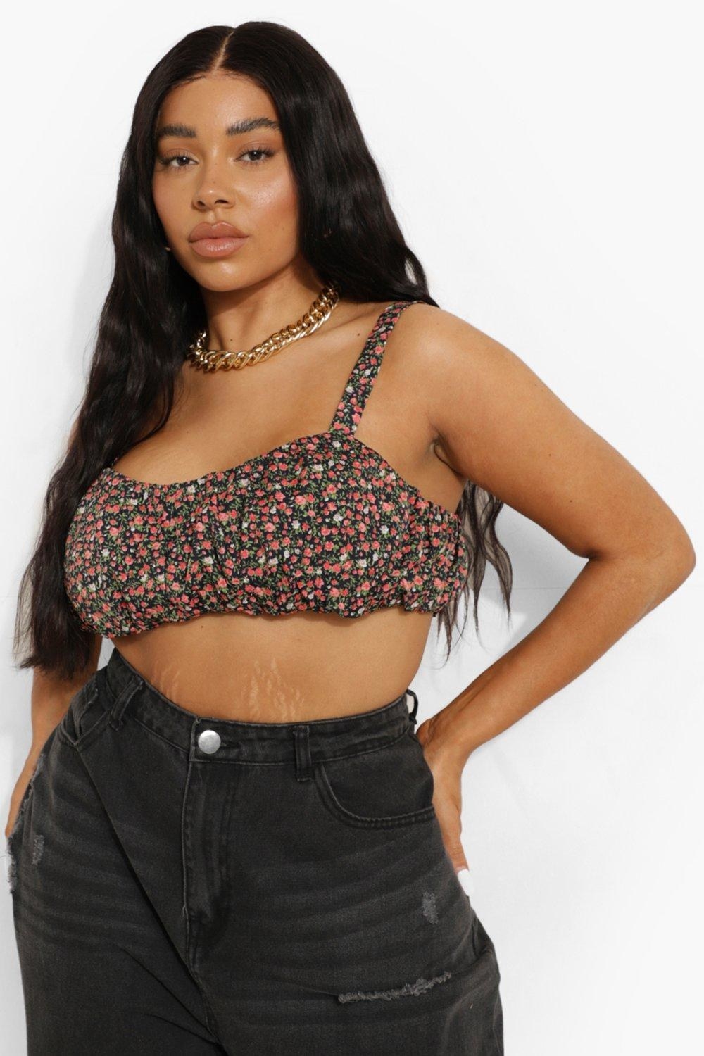 model in floral ruched crop top with ripped black jeans
