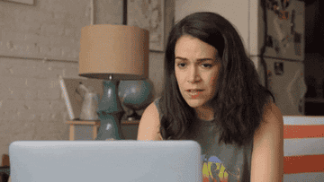 Abby from &quot;Broad City&quot; looks at her laptop and then reels back with a concerned expression