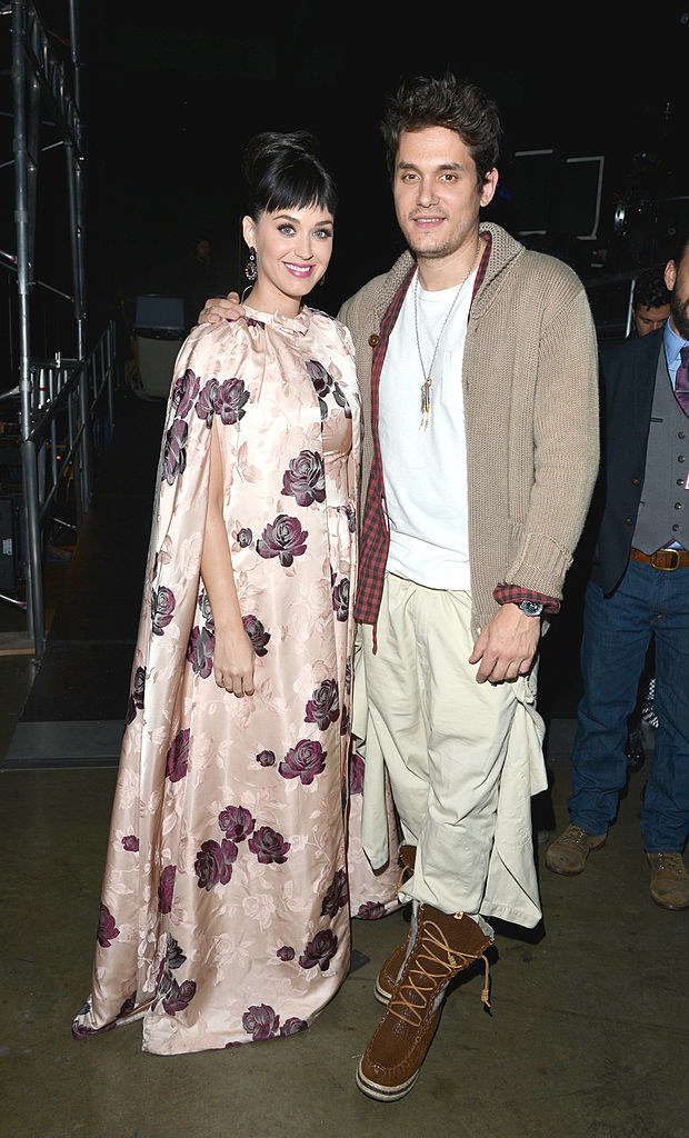 katy perry in a dress that looks like a curtain posing with mayer