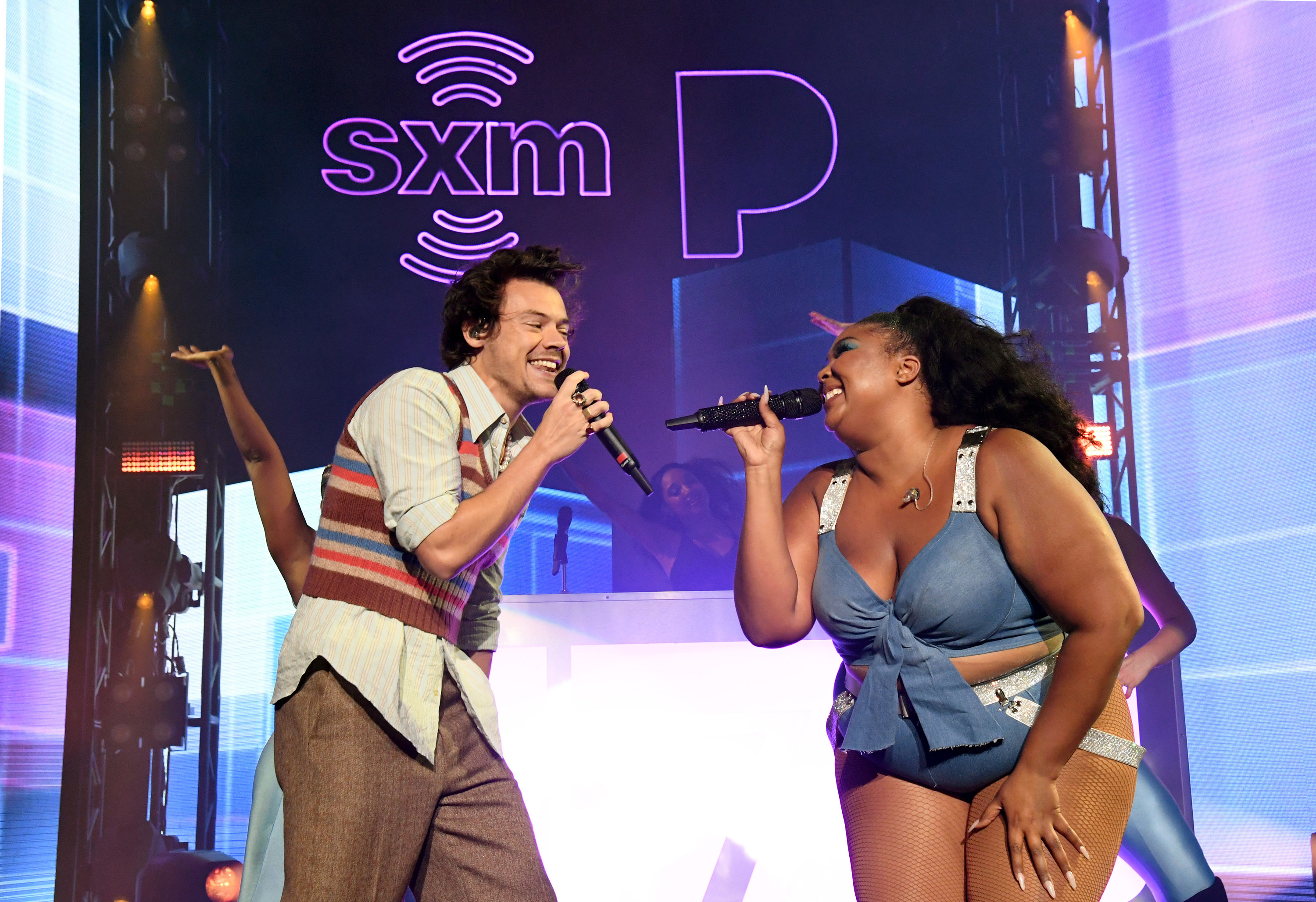 Harry Styles and Lizzo performing together on stage