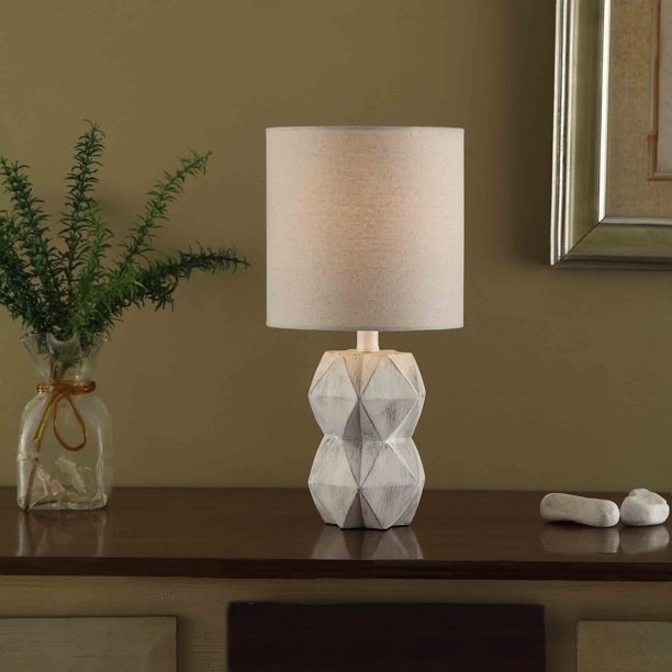 the whitewash wood lamp on a desk