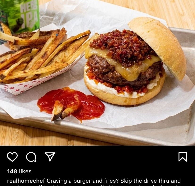 A picture of smoked gouda burger with bacon jam and french fries