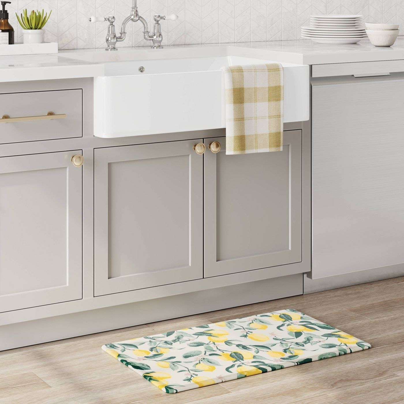 the lemon print mat in front of a kitchen sink