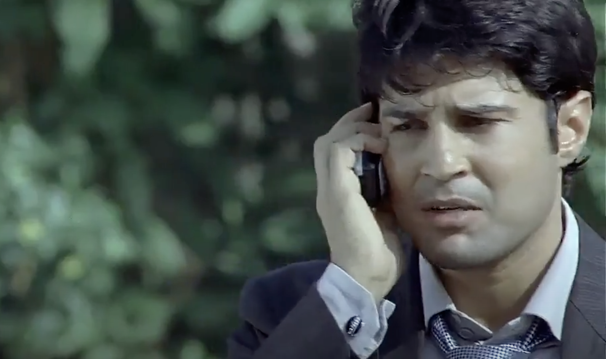 Rajeev Khandelwal talking on a mobile phone