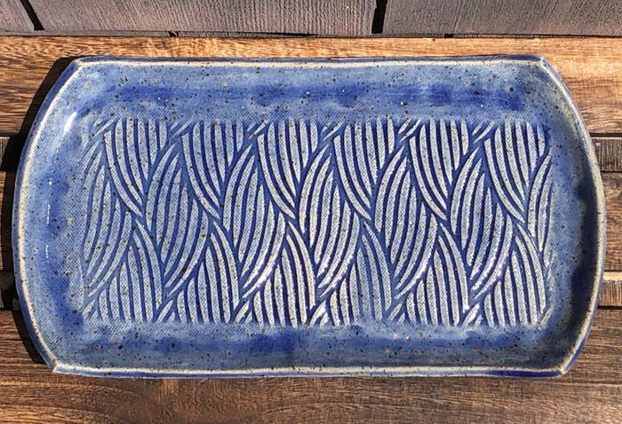 rectangular shaped serving tray with wavy design on it