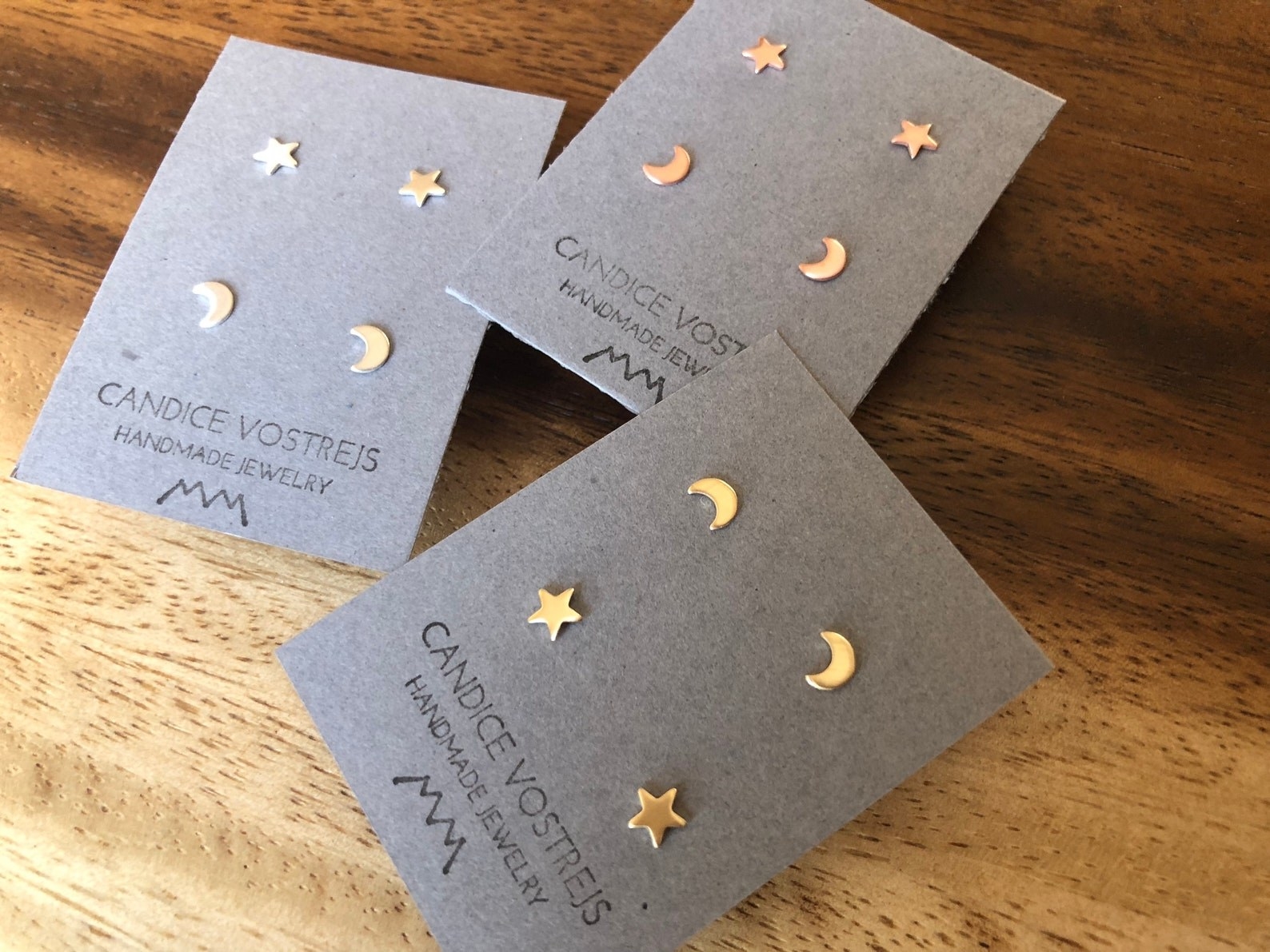 stud earrings in the shape of stars and crescent moons