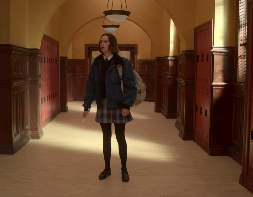 Casey standing in the middle of the hallway at her new school on &quot;Atypical&quot;