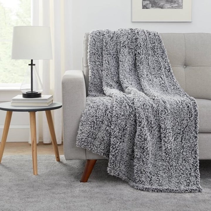 the gray blanket over a couch