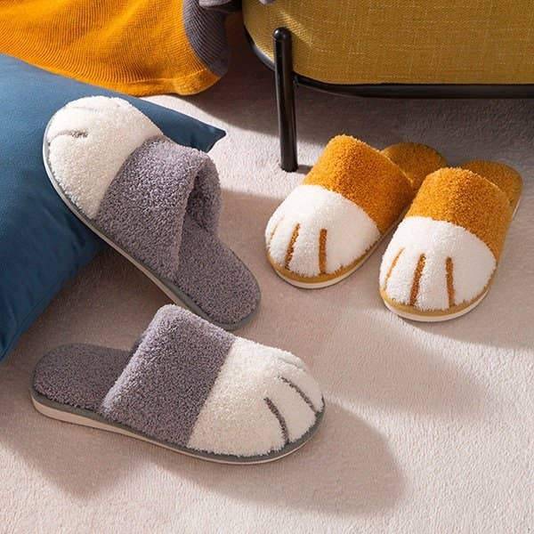 The cat paw slippers with an open back in a bedroom