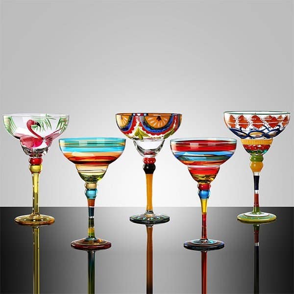 Five margarita glasses in a row each with a different design