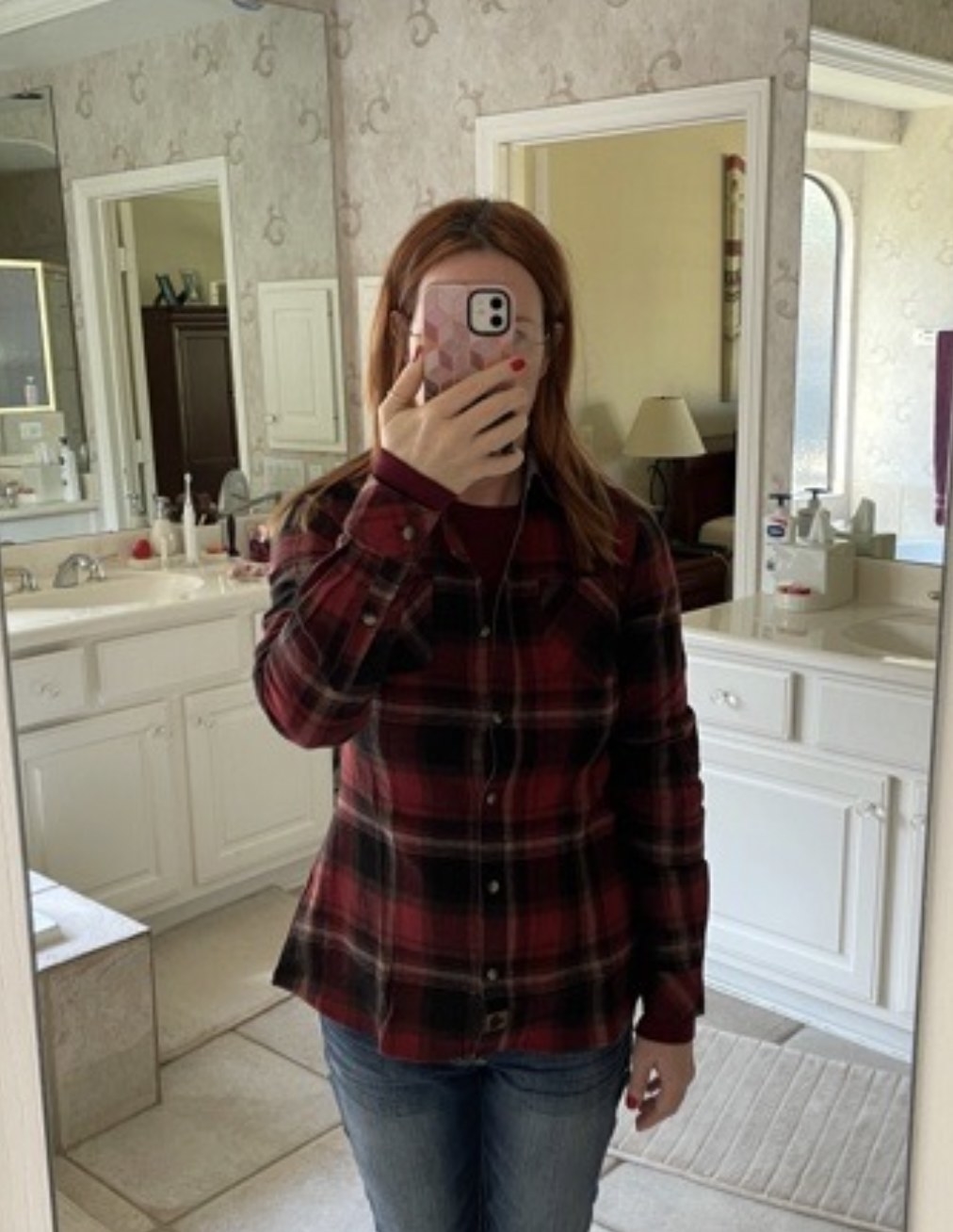 a reviewer wearing the flannel in red and black