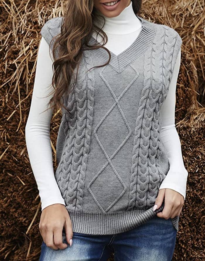 model wearing the sweater vest in grey