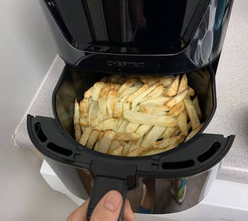 fries being made in an air fryer 