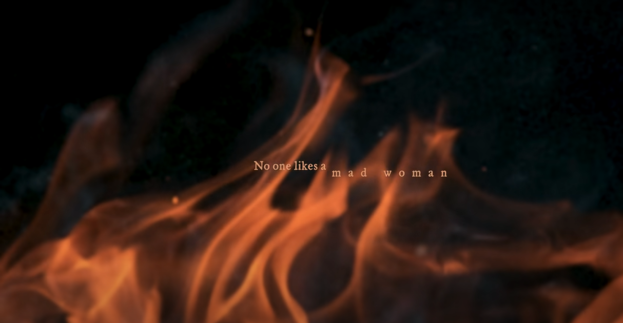 A fire with the words "No one likes a mad woman" in front of it