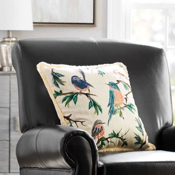 bird patterned pillow on chair