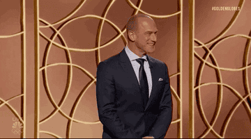 Gif of Christopher Meloni at the 2021 Golden Globes pumping his fists and shouting &quot;yeah&quot;