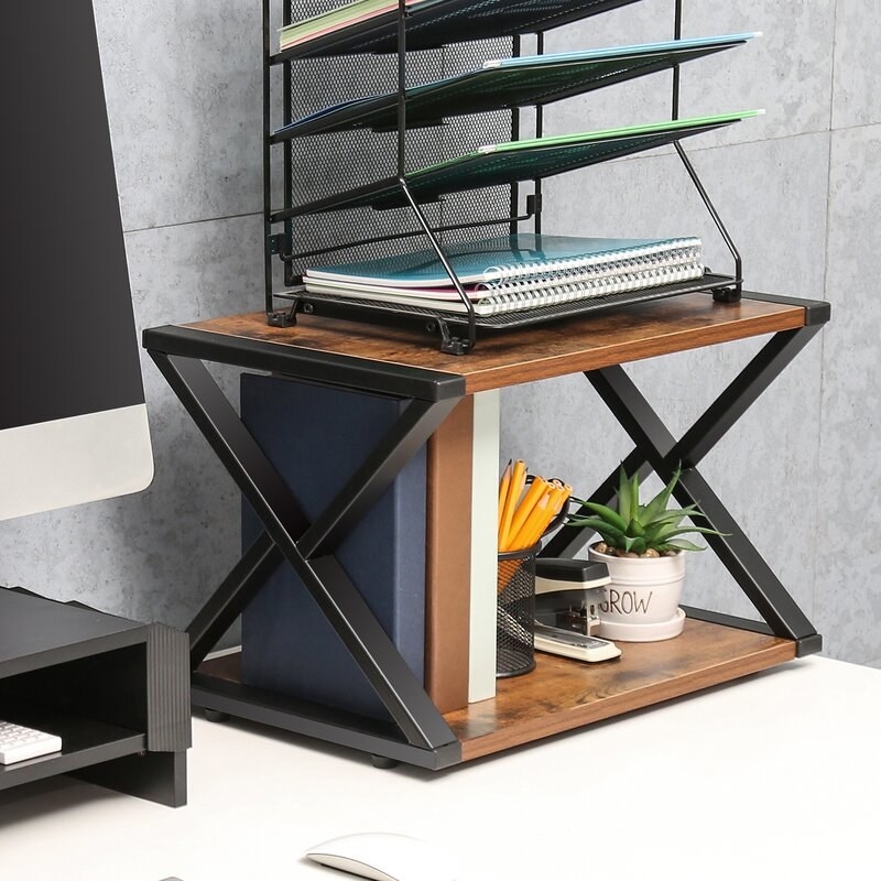 The desk organizer with assorted items on top