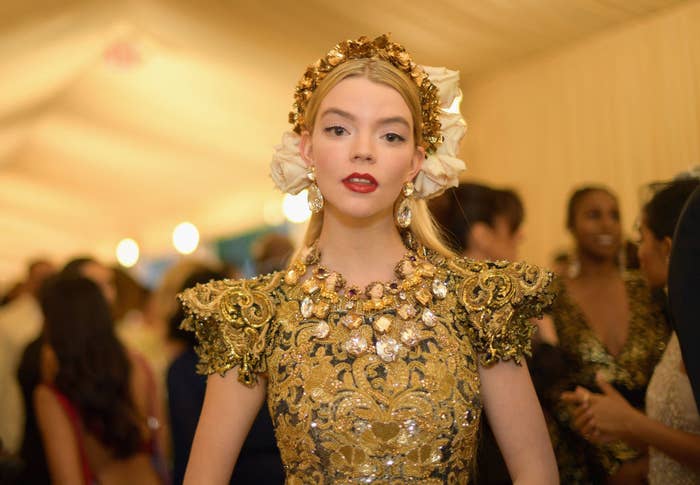 Anya wore an embroidered and embellished gown with pagoda shoulders and a matching headband