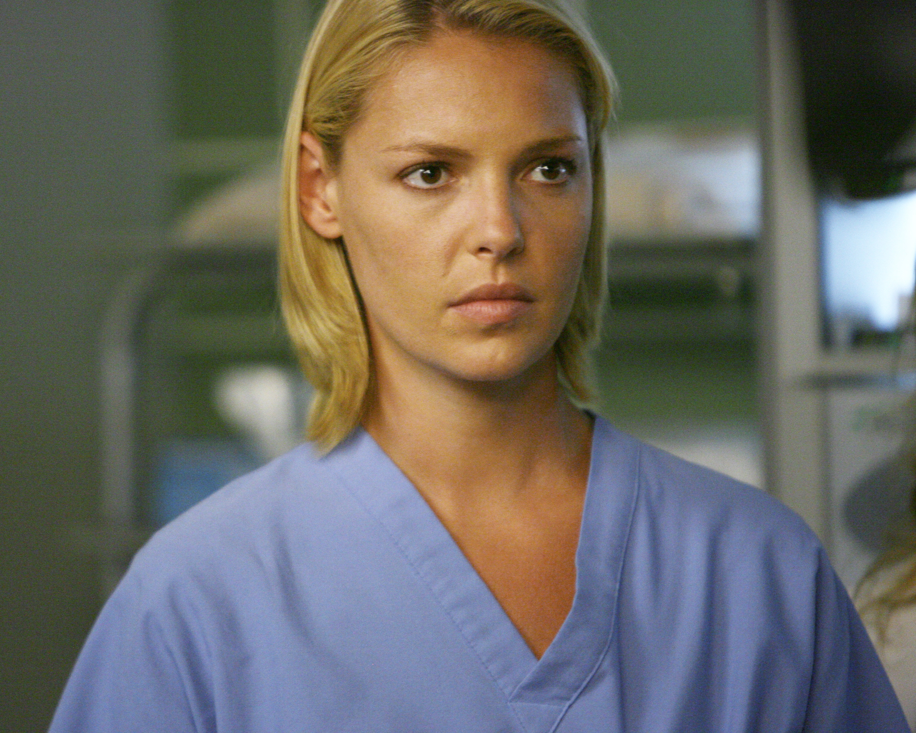 Heigl looks concerned while wearing scrubs