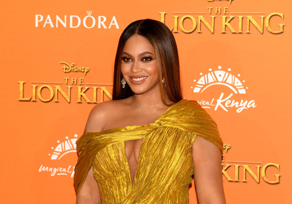 Beyonce in a gold dress at lion kind premiere