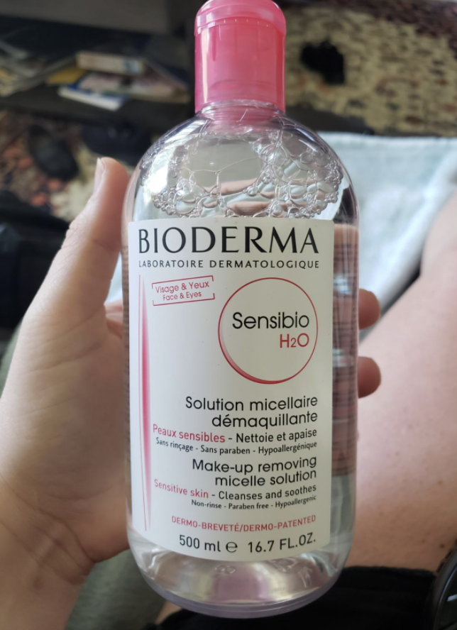 a reviewer holding the bottle of micellar water