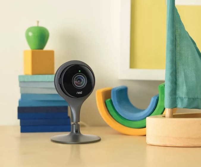 A grey/black, Google Nest camera in a child&#x27;s play room