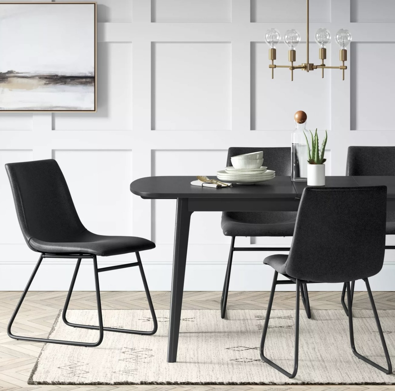 black leather upholstered chairs around a dining room table